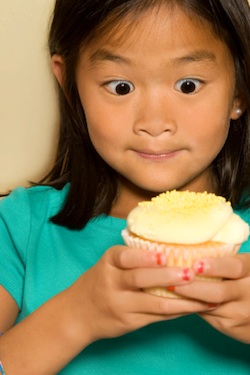 young girl with a cupcake